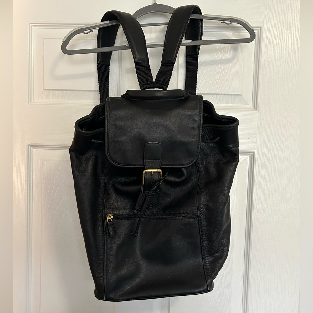 COACH black leather backpack.